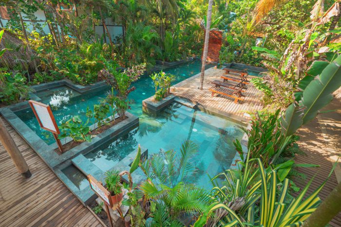 Photo of the tropical pool area at Costeno Beach hostel in Colombia