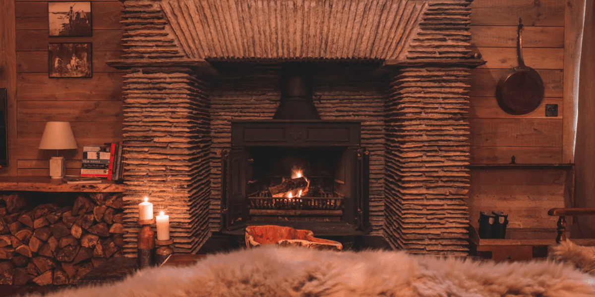 Photo of a cosy fire and fur rug