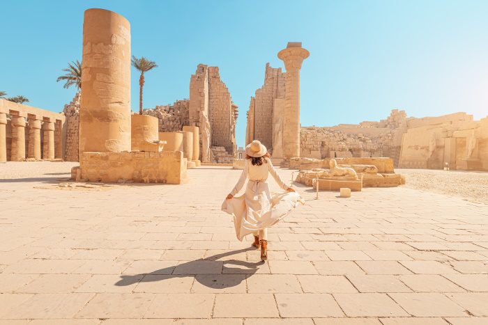 woman exploring ancient ruins
